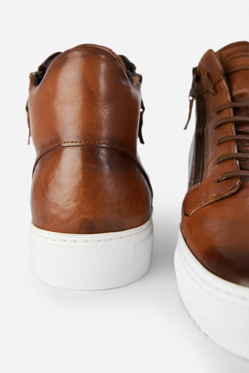 SOHO ROGUE cognac distressed high sneakers.