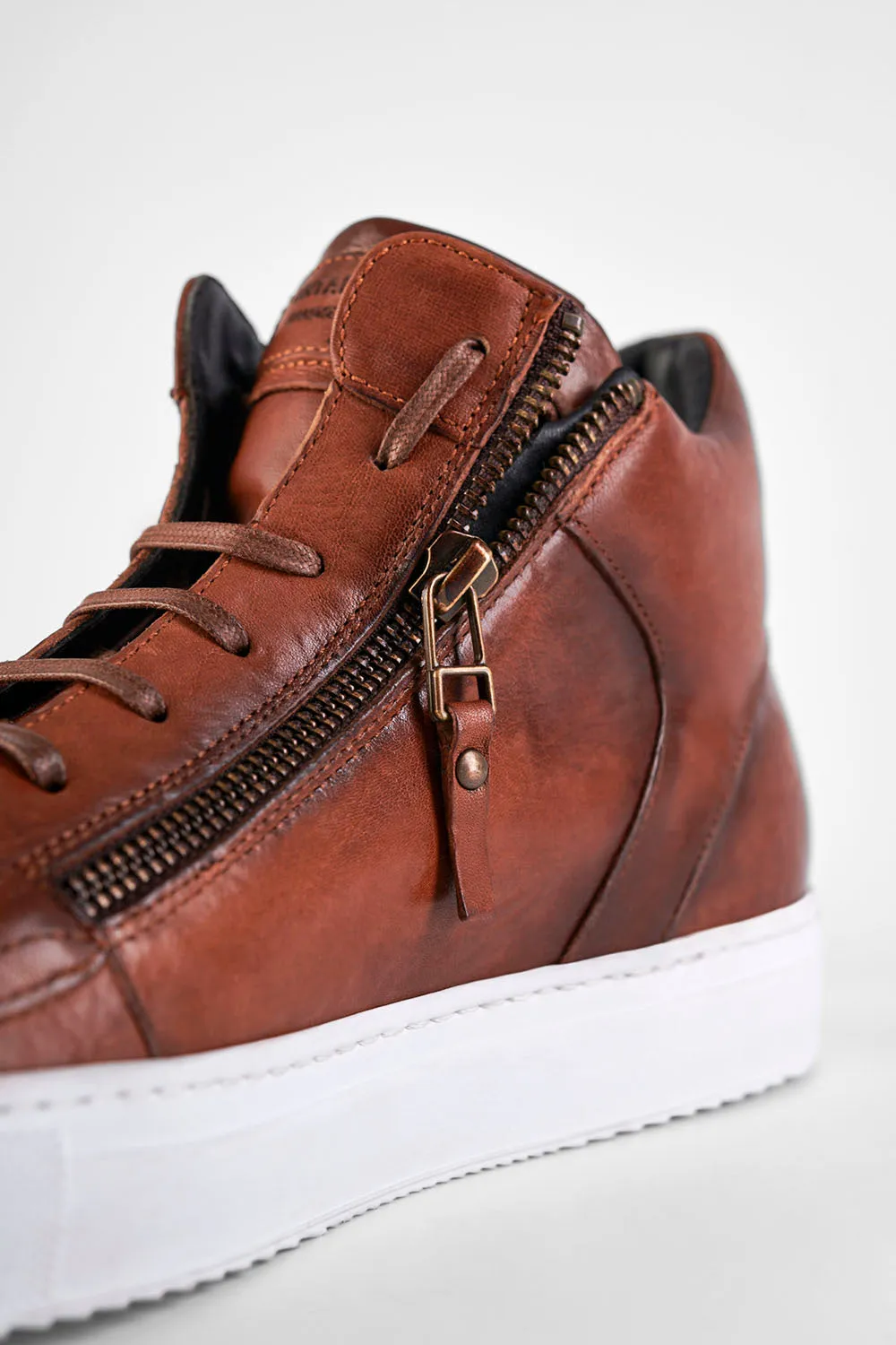 SOHO ROGUE cognac distressed high sneakers.
