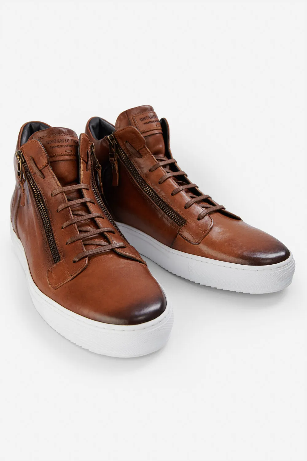 SOHO ROGUE cognac distressed high sneakers.