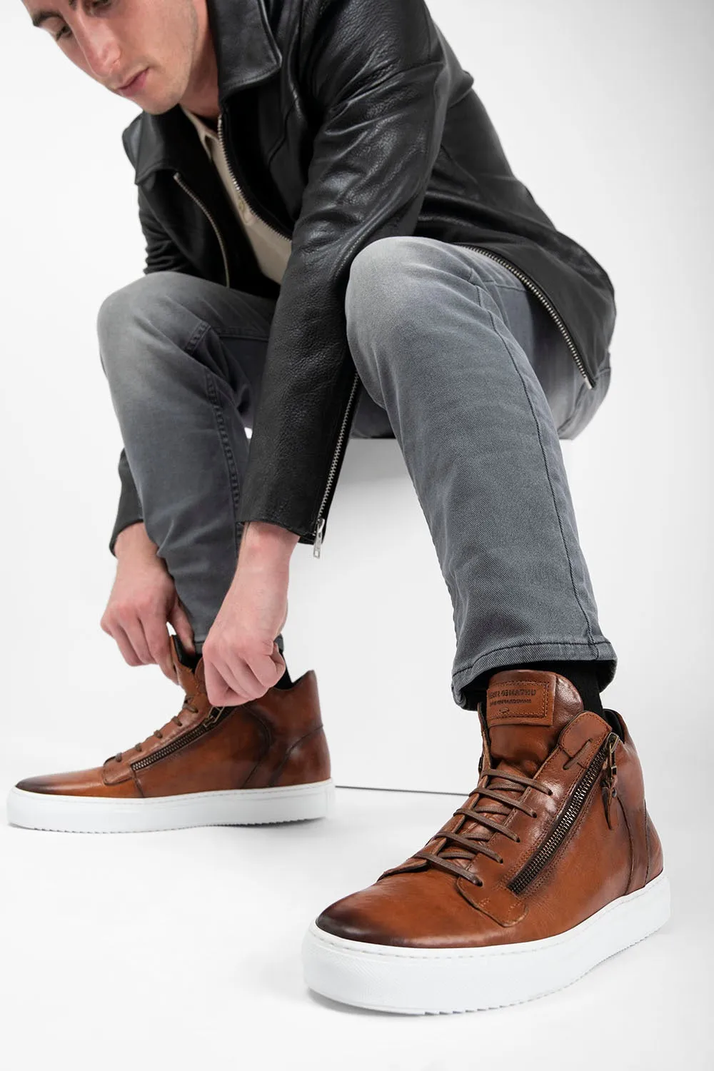 SOHO ROGUE cognac distressed high sneakers.