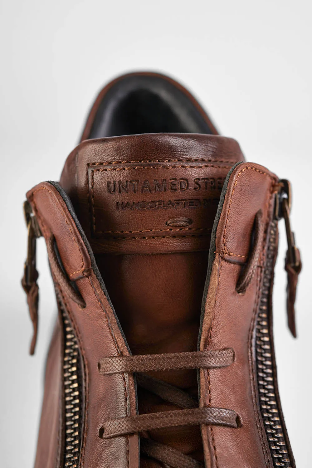 SOHO ROGUE cognac distressed high sneakers.