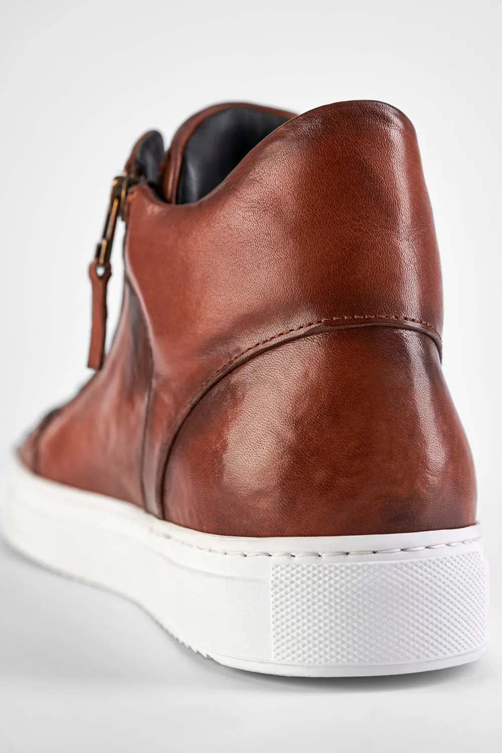 SOHO ROGUE cognac distressed high sneakers.