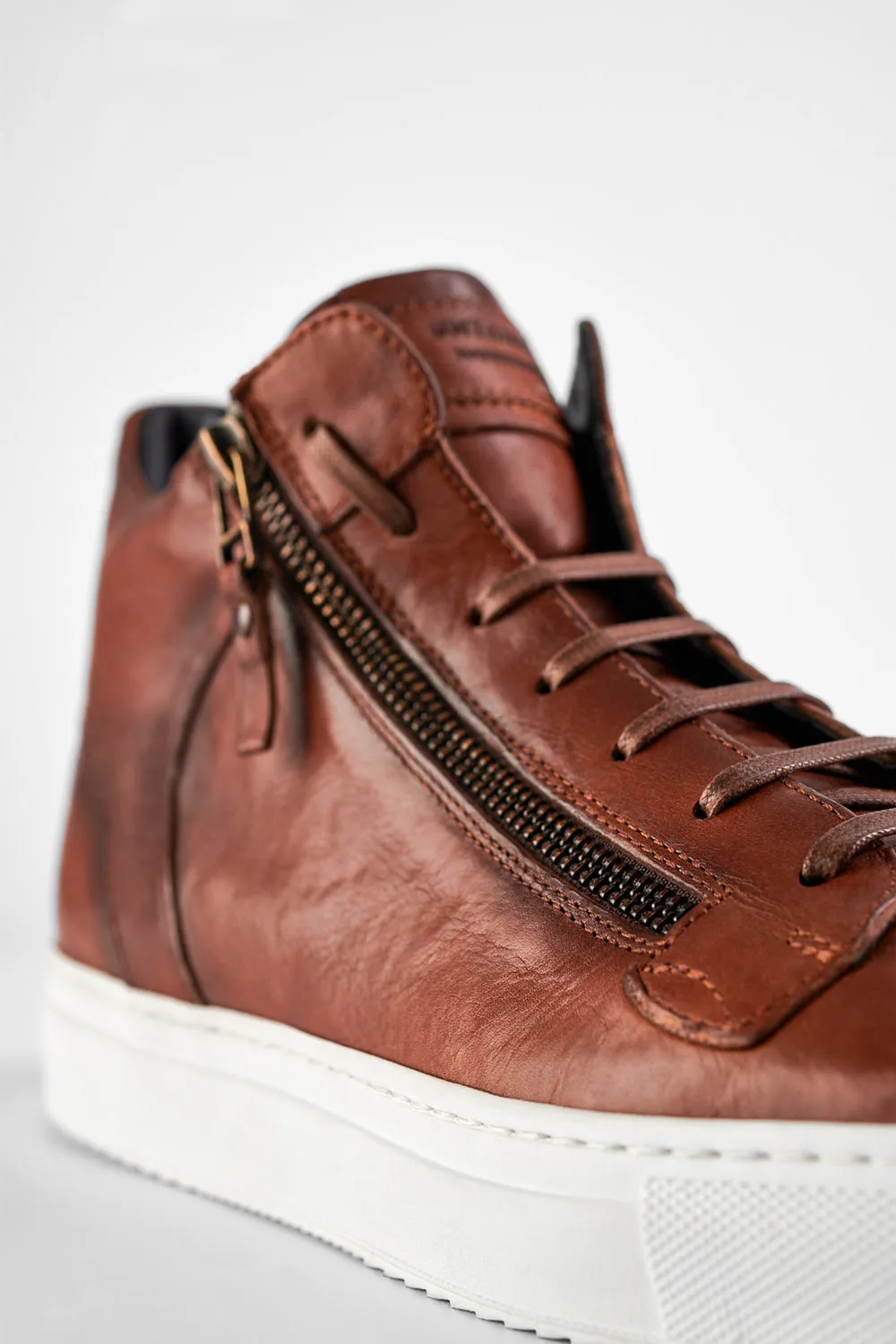 SOHO ROGUE cognac distressed high sneakers.
