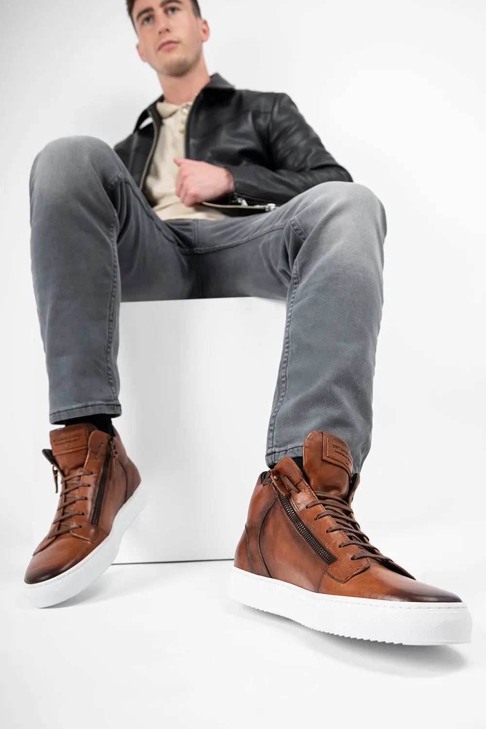 SOHO ROGUE cognac distressed high sneakers.