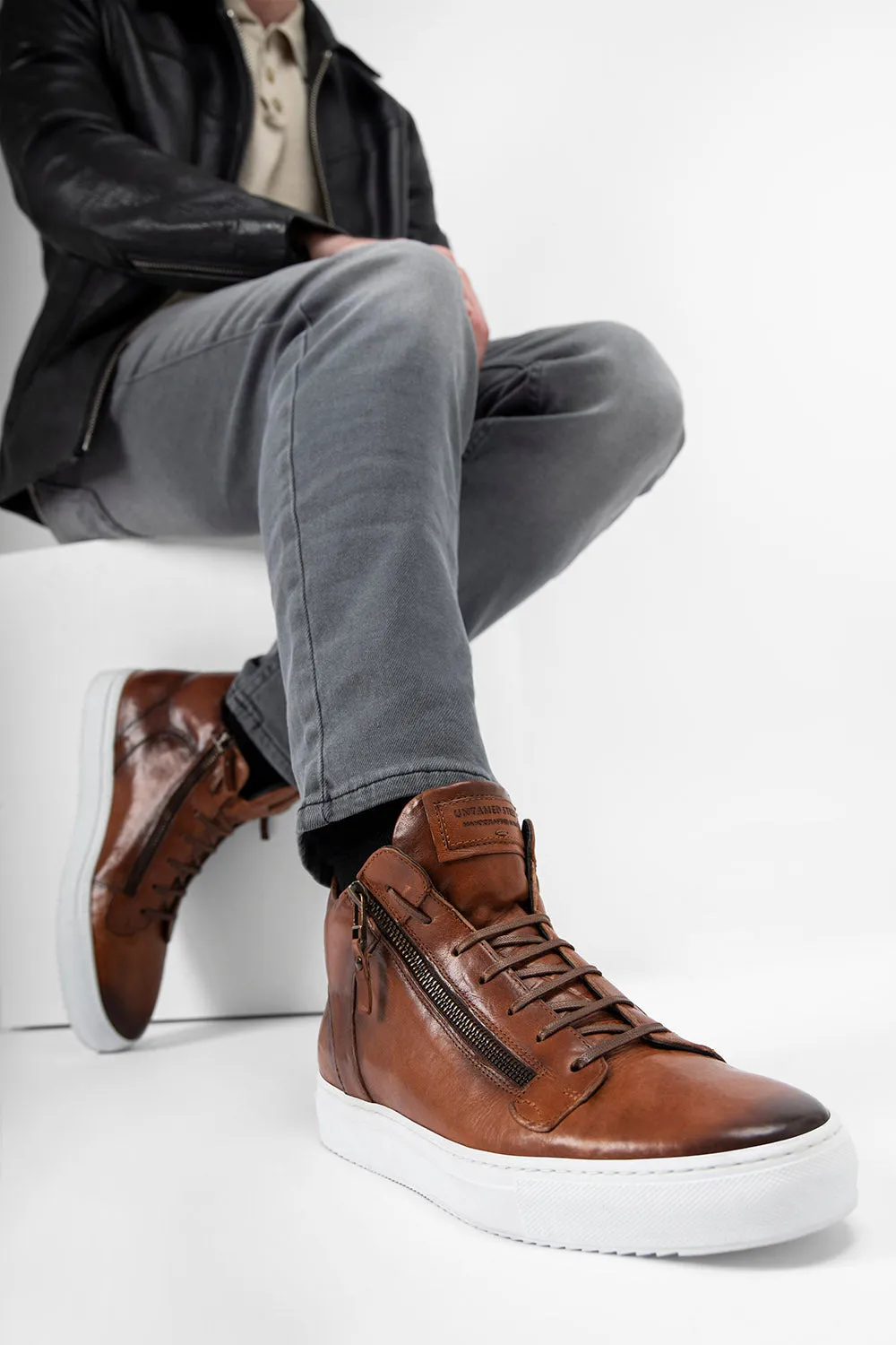 SOHO ROGUE cognac distressed high sneakers.
