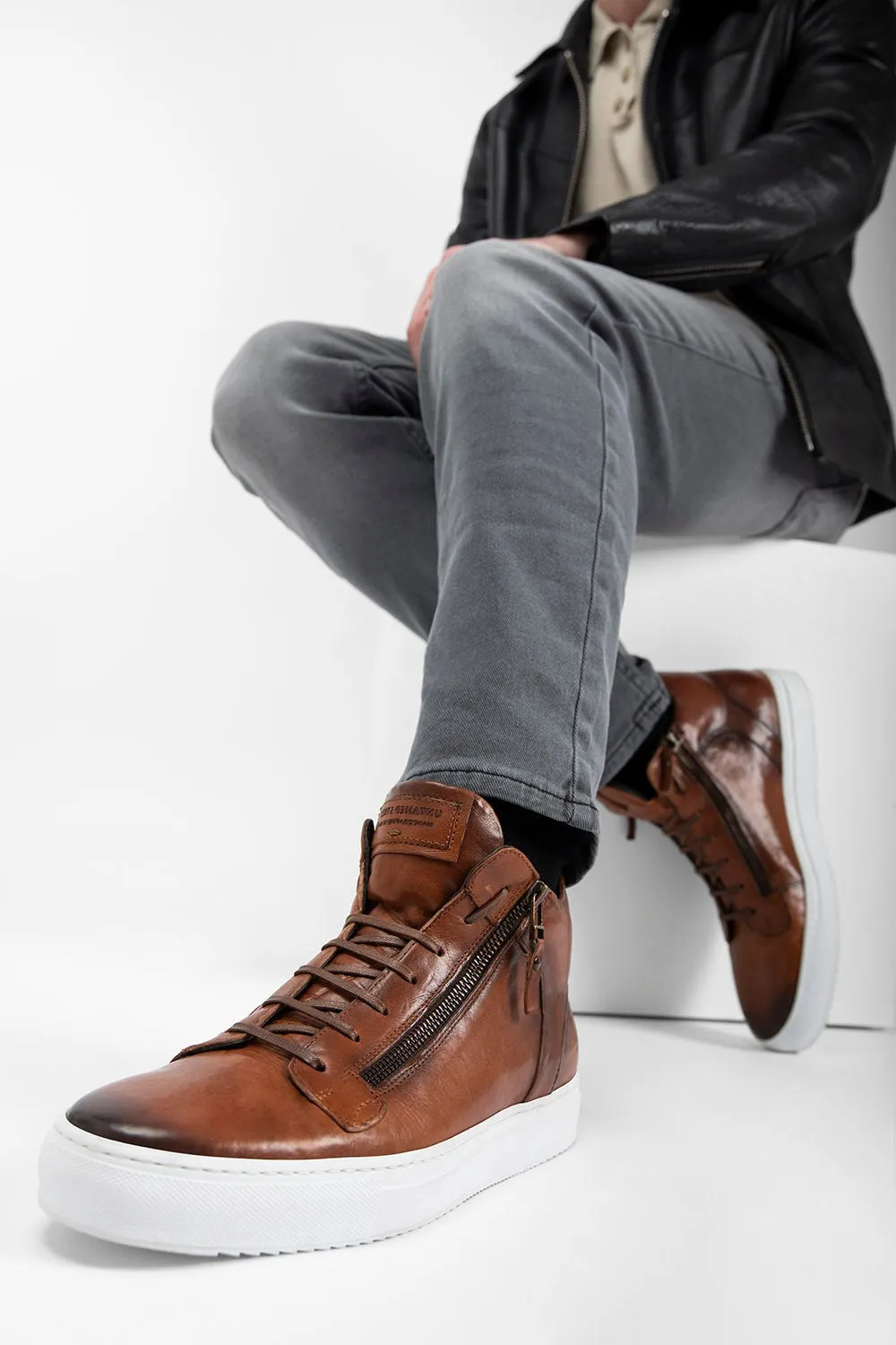 SOHO ROGUE cognac distressed high sneakers.