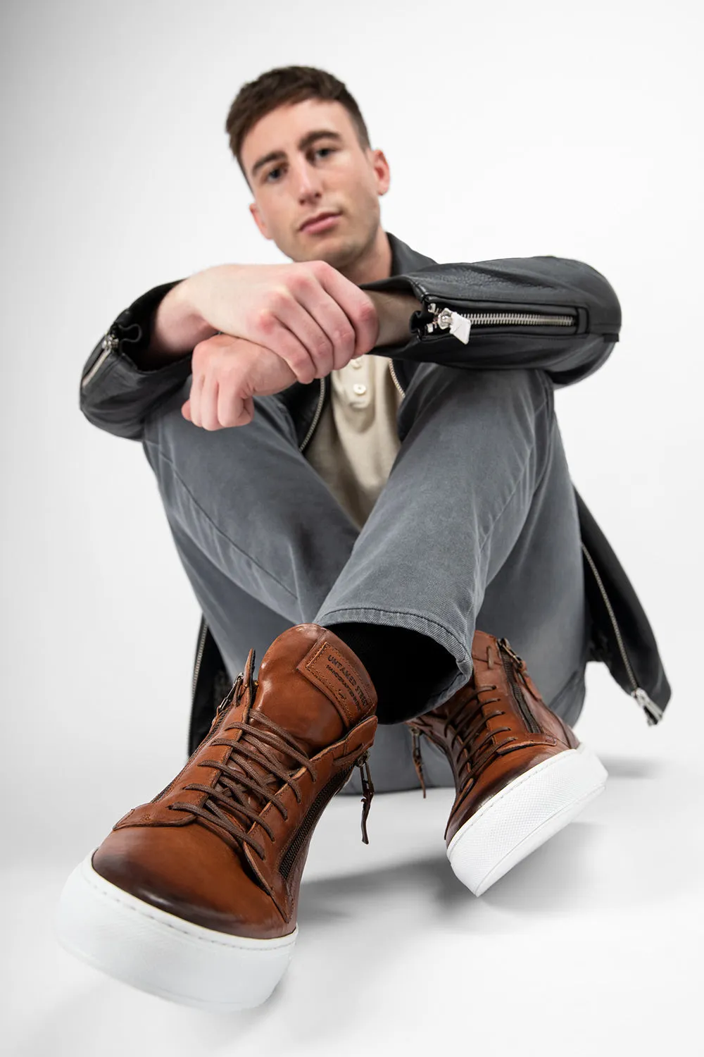 SOHO ROGUE cognac distressed high sneakers.